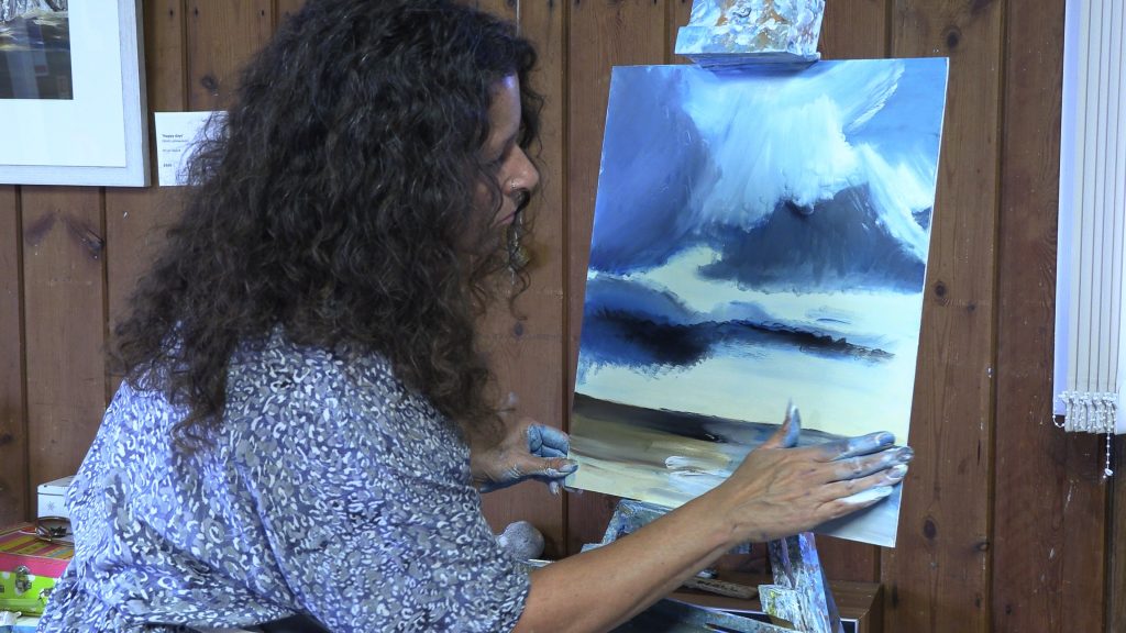 Sally Temple artist - painting Norfolk skies with hands